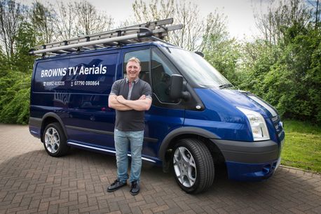 paul standing in forn of his browns tv aerials van